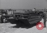 Image of U.S. war supplies come ashore at Normandy after D-Day Normandy France, 1944, second 47 stock footage video 65675037056