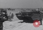 Image of U.S. war supplies come ashore at Normandy after D-Day Normandy France, 1944, second 49 stock footage video 65675037056