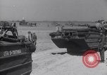 Image of U.S. war supplies come ashore at Normandy after D-Day Normandy France, 1944, second 50 stock footage video 65675037056