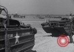 Image of U.S. war supplies come ashore at Normandy after D-Day Normandy France, 1944, second 51 stock footage video 65675037056