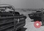Image of U.S. war supplies come ashore at Normandy after D-Day Normandy France, 1944, second 52 stock footage video 65675037056