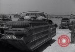 Image of U.S. war supplies come ashore at Normandy after D-Day Normandy France, 1944, second 55 stock footage video 65675037056