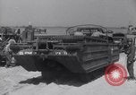 Image of U.S. war supplies come ashore at Normandy after D-Day Normandy France, 1944, second 57 stock footage video 65675037056
