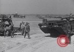 Image of U.S. war supplies come ashore at Normandy after D-Day Normandy France, 1944, second 60 stock footage video 65675037056