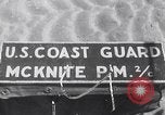 Image of U.S. troops hold German POWs on Normandy beach in World War II Normandy France, 1944, second 1 stock footage video 65675037057