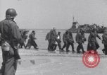 Image of U.S. troops hold German POWs on Normandy beach in World War II Normandy France, 1944, second 7 stock footage video 65675037057