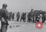 Image of U.S. troops hold German POWs on Normandy beach in World War II Normandy France, 1944, second 10 stock footage video 65675037057