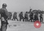 Image of U.S. troops hold German POWs on Normandy beach in World War II Normandy France, 1944, second 12 stock footage video 65675037057