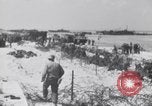 Image of U.S. troops hold German POWs on Normandy beach in World War II Normandy France, 1944, second 28 stock footage video 65675037057