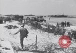 Image of U.S. troops hold German POWs on Normandy beach in World War II Normandy France, 1944, second 29 stock footage video 65675037057