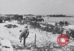 Image of U.S. troops hold German POWs on Normandy beach in World War II Normandy France, 1944, second 30 stock footage video 65675037057