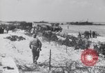 Image of U.S. troops hold German POWs on Normandy beach in World War II Normandy France, 1944, second 31 stock footage video 65675037057
