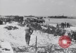 Image of U.S. troops hold German POWs on Normandy beach in World War II Normandy France, 1944, second 32 stock footage video 65675037057