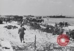 Image of U.S. troops hold German POWs on Normandy beach in World War II Normandy France, 1944, second 34 stock footage video 65675037057