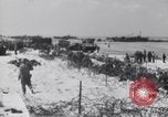 Image of U.S. troops hold German POWs on Normandy beach in World War II Normandy France, 1944, second 37 stock footage video 65675037057