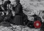 Image of U.S. troops hold German POWs on Normandy beach in World War II Normandy France, 1944, second 40 stock footage video 65675037057