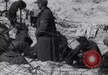 Image of U.S. troops hold German POWs on Normandy beach in World War II Normandy France, 1944, second 43 stock footage video 65675037057