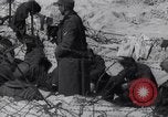 Image of U.S. troops hold German POWs on Normandy beach in World War II Normandy France, 1944, second 44 stock footage video 65675037057