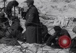 Image of U.S. troops hold German POWs on Normandy beach in World War II Normandy France, 1944, second 47 stock footage video 65675037057