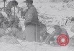 Image of U.S. troops hold German POWs on Normandy beach in World War II Normandy France, 1944, second 50 stock footage video 65675037057