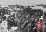 Image of U.S. troops hold German POWs on Normandy beach in World War II Normandy France, 1944, second 61 stock footage video 65675037057