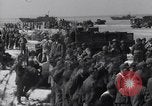 Image of U.S. troops hold German POWs on Normandy beach in World War II Normandy France, 1944, second 62 stock footage video 65675037057