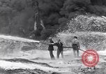 Standbild bombardiert Ölversorgung Depot Vereinigtes Königreich, 1944, aus Sekunde 33 historischem Filmmaterial Videoclip 65675037073