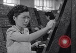 Standbild junge Japanisch-amerikanisches Mädchen arbeiten auf Print Shop Honolulu Hawaii USA, 1942, aus Sekunde 20 historischem Filmmaterial Videoclip 65675037122