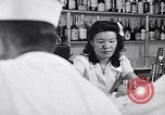 Image of Scenes in city a year after Japanese attack on Pearl Harbor Honolulu Hawaii USA, 1942, second 4 stock footage video 65675037124