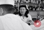 Image of Scenes in city a year after Japanese attack on Pearl Harbor Honolulu Hawaii USA, 1942, second 12 stock footage video 65675037124