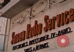 Image of signboards of various shops and services Saigon Vietnam, 1967, second 6 stock footage video 65675037265