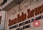 Image of signboards of various shops and services Saigon Vietnam, 1967, second 12 stock footage video 65675037265