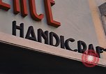 Image of signboards of various shops and services Saigon Vietnam, 1967, second 17 stock footage video 65675037265