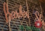 Image of signboards of various shops and services Saigon Vietnam, 1967, second 37 stock footage video 65675037265
