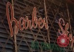Image of signboards of various shops and services Saigon Vietnam, 1967, second 46 stock footage video 65675037265