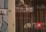 Image of signboards of various shops and services Saigon Vietnam, 1967, second 50 stock footage video 65675037265