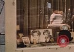 Image of signboards of various shops and services Saigon Vietnam, 1967, second 53 stock footage video 65675037265