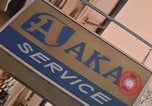 Image of signboards of various shops and services Saigon Vietnam, 1967, second 59 stock footage video 65675037265