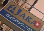 Image of signboards of various shops and services Saigon Vietnam, 1967, second 61 stock footage video 65675037265