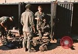 Image of unloading combat gear Vietnam, 1969, second 5 stock footage video 65675037300