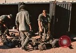 Image of unloading combat gear Vietnam, 1969, second 8 stock footage video 65675037300