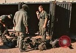 Image of unloading combat gear Vietnam, 1969, second 9 stock footage video 65675037300