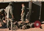 Image of unloading combat gear Vietnam, 1969, second 10 stock footage video 65675037300