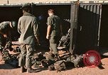 Image of unloading combat gear Vietnam, 1969, second 11 stock footage video 65675037300