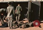 Image of unloading combat gear Vietnam, 1969, second 12 stock footage video 65675037300