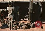 Image of unloading combat gear Vietnam, 1969, second 13 stock footage video 65675037300