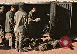 Image of unloading combat gear Vietnam, 1969, second 16 stock footage video 65675037300