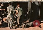 Image of unloading combat gear Vietnam, 1969, second 18 stock footage video 65675037300