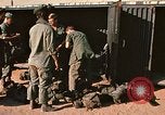Image of unloading combat gear Vietnam, 1969, second 20 stock footage video 65675037300