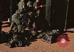 Image of unloading combat gear Vietnam, 1969, second 21 stock footage video 65675037300